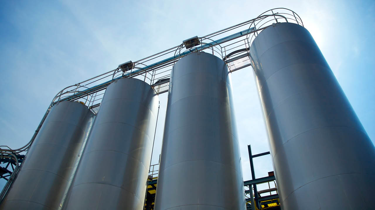 Four industrial silos container. Circular shape. 