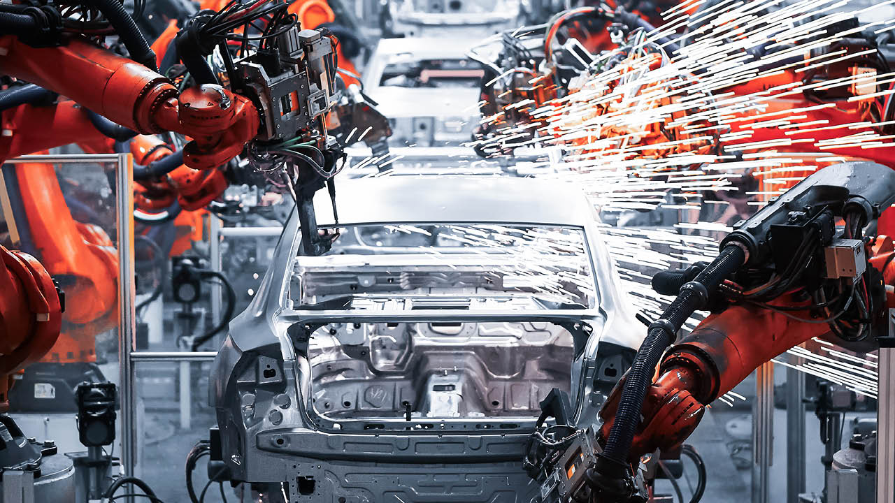 In the industrial production workshop, the robot arm of the automobile production line is working