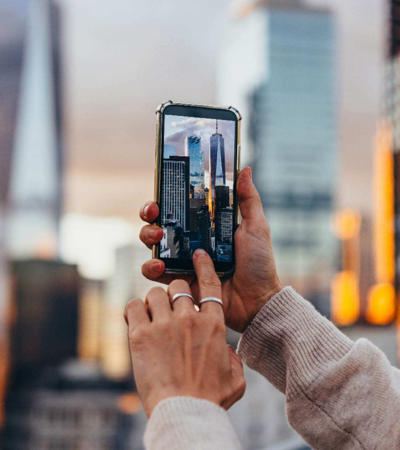 A person takes a mobile photo of the Manhattan skyline in New York City, United States.